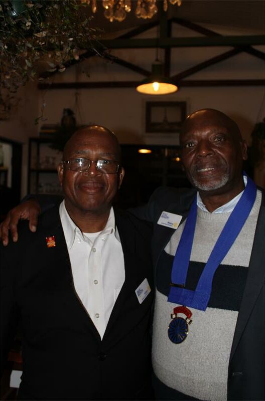 Two black men standing next to each other
