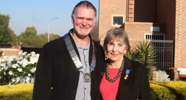 Man and woman smiling at the camera