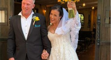 Photo of a bride and groom leaving a church