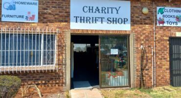 Building with sign indicating thrift shop