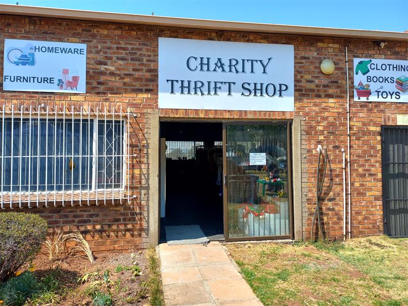 Building with sign indicating thrift shop