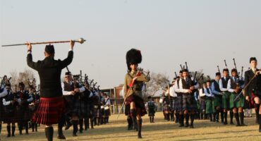 Group of people playing bag pipes