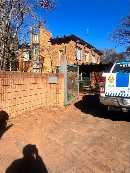 EMPD vehicle standing in front of a double storey house