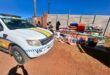 EMPD vehicle parked next to a road side trader displaying blankets