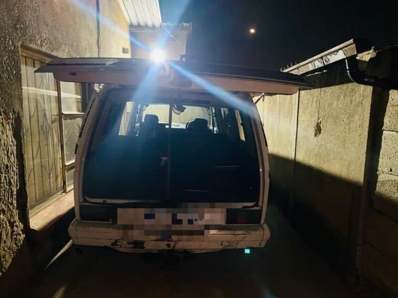 The back view of a minibus with the door open.