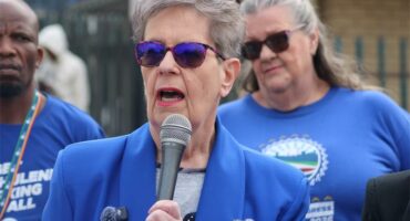 women in blue political regalia