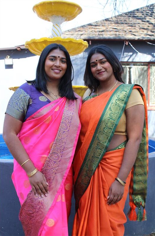 Two Indian women wearing colourful saris
