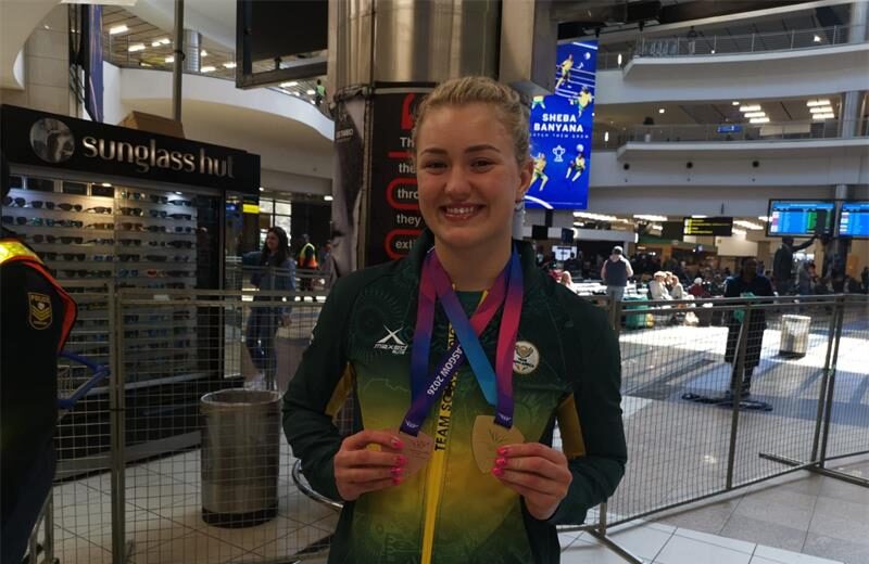 She defended her 50m breaststroke title and added a 4x100m medley relay bronze to end the games with two medals.
