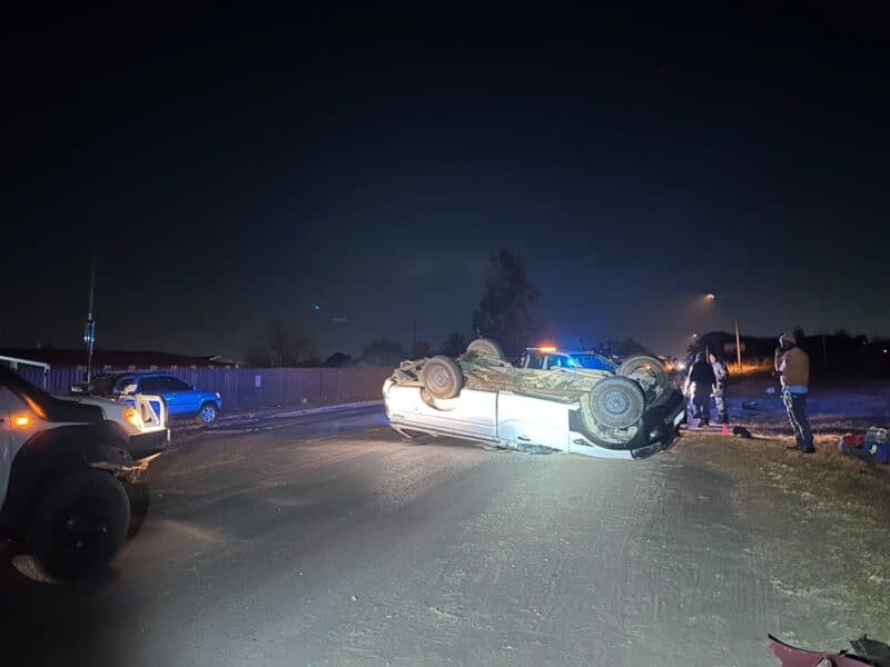Accident scene with a vehicle on its roof