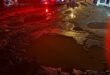 Accident scene with the focus being water filled potholes