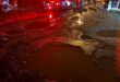 Accident scene with the focus being water filled potholes