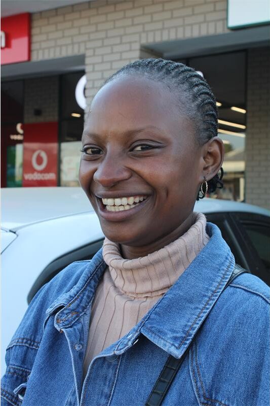 Black woman with braids smiling