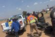 EMPD officer carrying a tyre to a marked EMPD vehicle