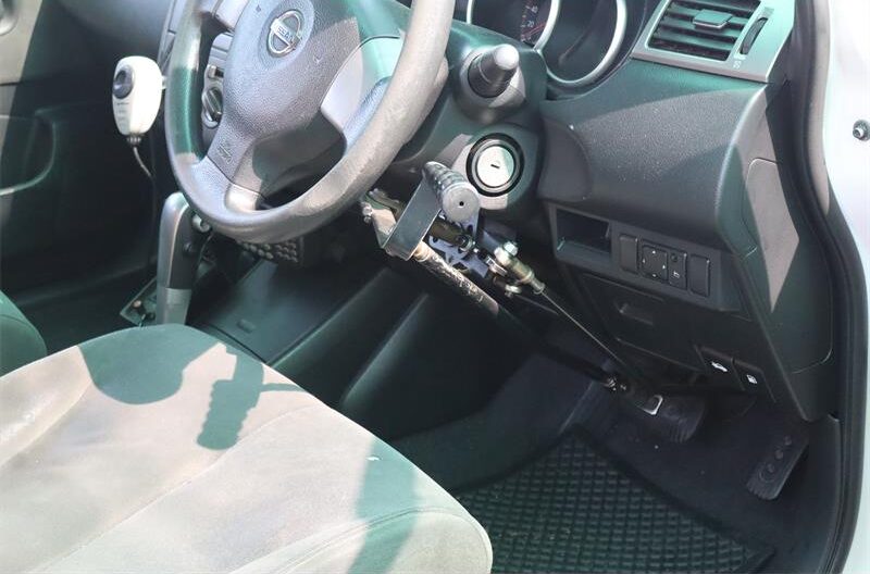 Image of the interior of a car with a mechanism to control the accelerator and brake pedals