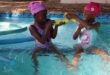two children in a swimming pool
