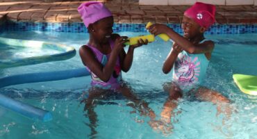 two children in a swimming pool