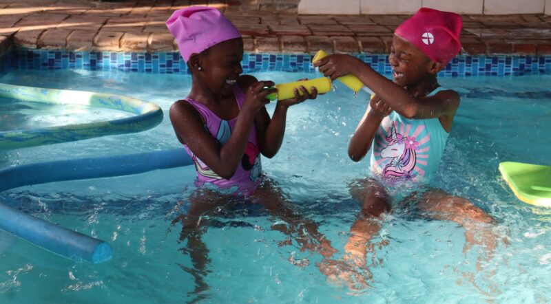 two children in a swimming pool