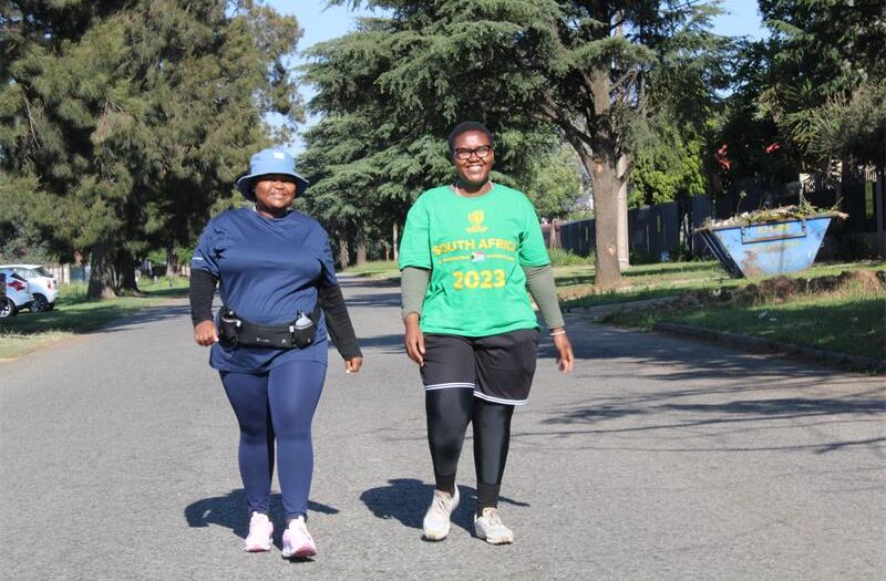Two black women walking in the street