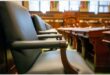 A side view of chairs inside a council chamber.