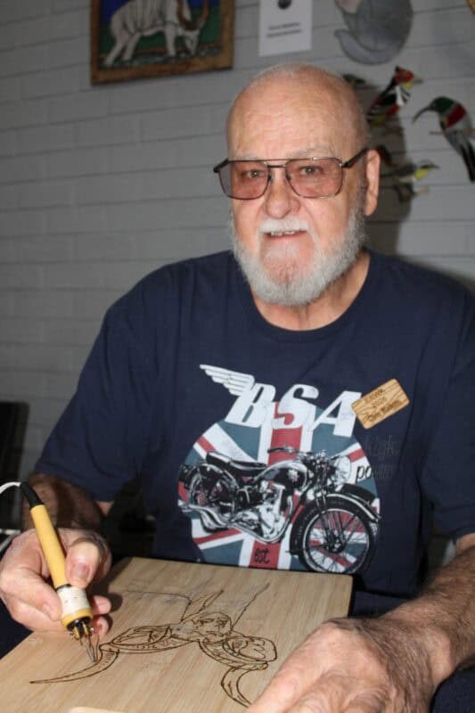 Man holding a soldering pen