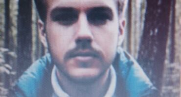 Photo of young white male with a moustache