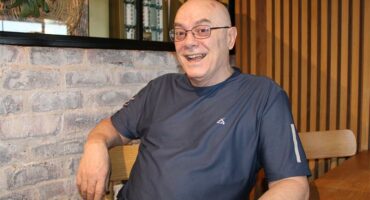 Elderly white man smiling
