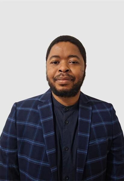 Black man wearing a blue suit