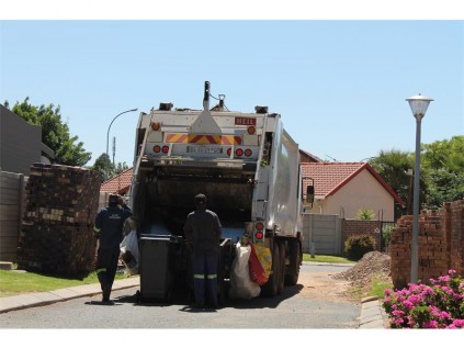 The trucks used for collection have been fitted with a mechanism that picks up the bin itself, then loads the refuse into the compactor.