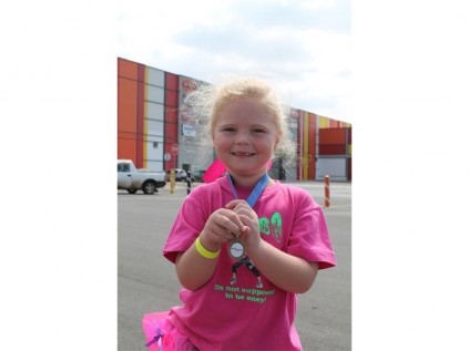 Roxy van Rooyen (4) proudly showed off her medal after completing the walk.
