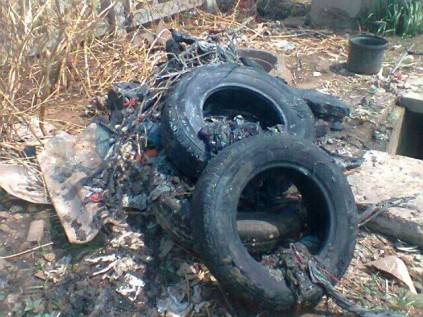 Tyres and other Items discovered by engineers while unblocking a sewer manhole.