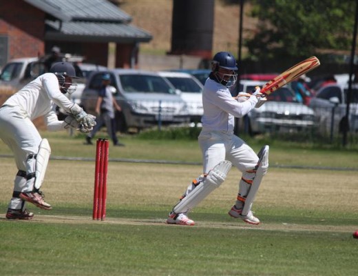 Jose van der Berg plays a shot during his batting innings as Bedfordview wicketkeeper Darryn De Kock looks on from behind the stumps.