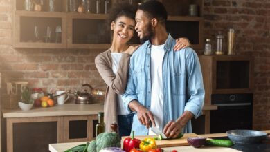 Loving,Black,Couple,Preparing,Salad,In,Loft,Kitchen,At,Home