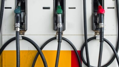 8433321 - front of three gas pump nozzles at gas station ready to work