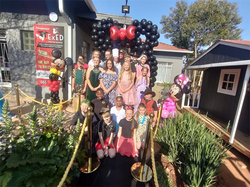 The entrance of the school was decorated with a Mickey Mouse balloon arch and red carpet.