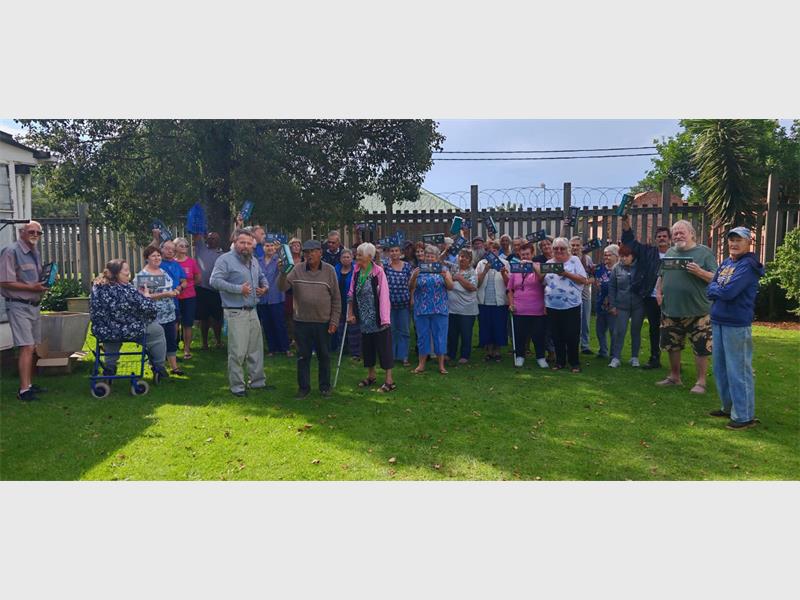 Due to continued burglaries and thefts at the Tweedy Park Old Age Home, now targeting recently donated solar flood lights, residents received an additional donation of floodlights.