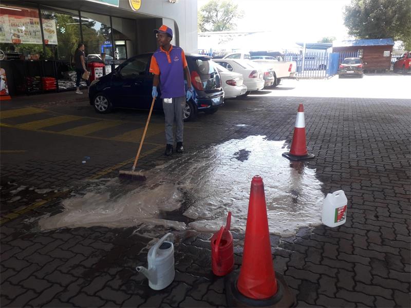 Staff were seen cleaning the spot where Wiandre Pretorius died, as vehicles continued to come and go, and the petrol station returned to business as usual.