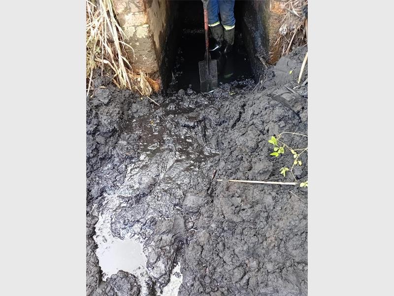 Oil and waste entering the stormwater system have added to infrastructure damage, with enforcement action now underway alongside repair work.