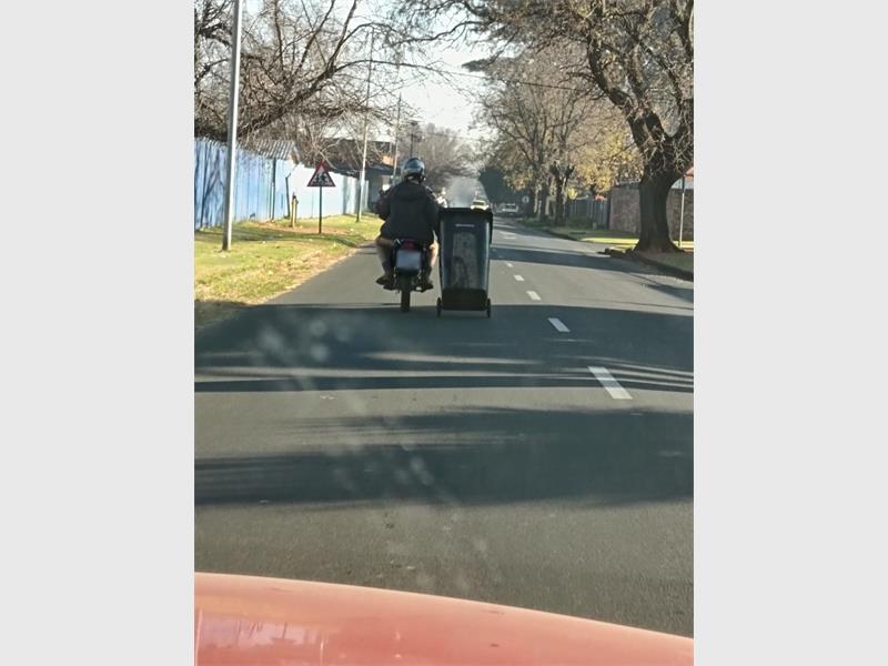 Forget the rubbish truck – one biker appears to have taken matters into his own hands.
