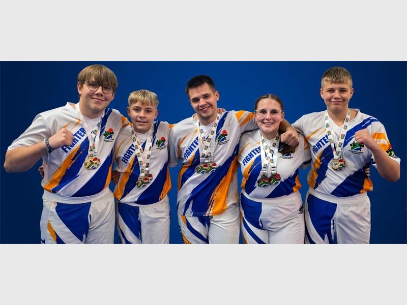 The five fighters from a local gym collected medals like toys at the national championship in George.