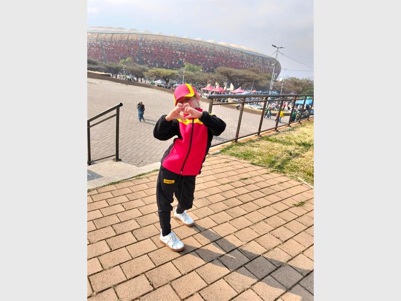 A young rugby fan from Felicitas School fulfills her dream of handing over the match ball at FNB Stadium.