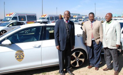 Ekurhuleni Executive Mayor Clr Mondli Gungubele (left), Member of Mayoral Committee for Community Safety Mthuthuzeli Siboza and Chief Whip of Council Robert Mashego pose in front of one of the new Ekurhuleni Metro Police SWAT vehicles which were unveiled today.