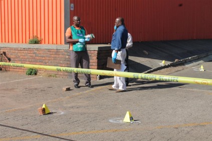 SAPS crimescene investigators at work on the scene at Trade Centre.