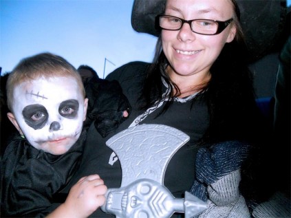 A cute zombie boy loking tired out from all the Halloween excitement.