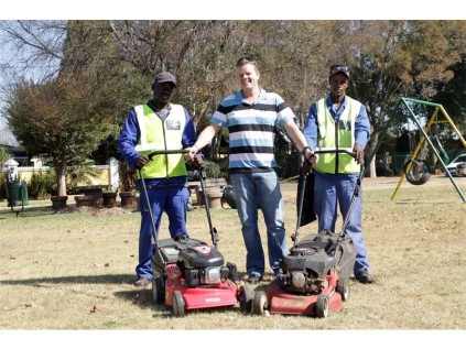 Joel Ramudzuli (left) and John Tlakotja (right) are cleaning the park in Singlehurst Street, Casseldale once a week. With them is Llewellyn Scheepers from the company that is sponsoring them to do the work.