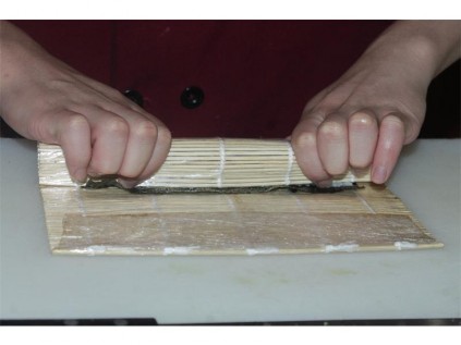 Press the sushi into a rectangle.