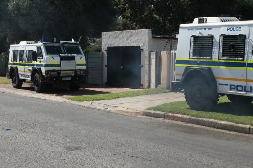 Two SAPS caspers after a raid on a property in Selection Park on Thursday morning (note the gate in the photo is not that of the raided property)
