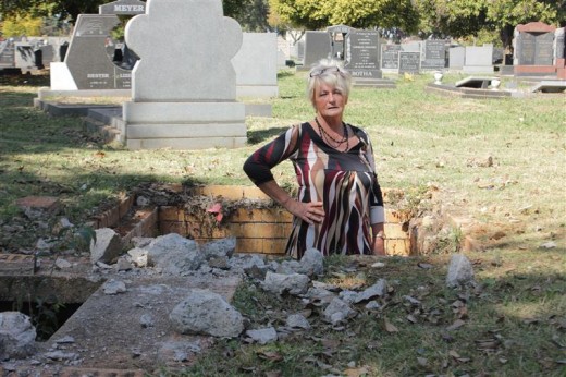 Other manholes in the cemetery have still not been closed or temporarily sectioned off. Cora Dixon is almost swallowed up by this open manhole.
