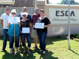 Louis Blignaut (back left), Willem van Wyk, Jaco Langeveldt, Marie van Wyk, Yvonne Strydom and Yolandi Langeveld gathered outside Esda Retirement Village in support of the elderly.