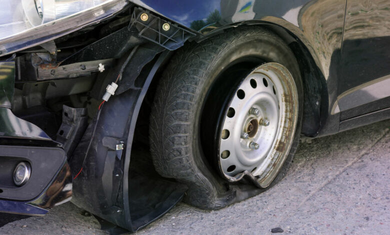 Accident on the road with damage to the car. knocked wheel.