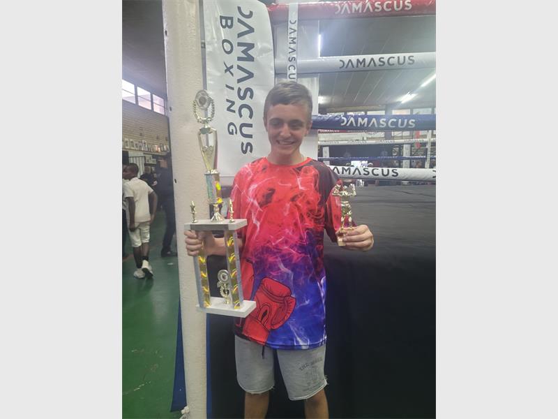 Bert Collins Boxing Club returned home with two victories and a best boxer award after competing at the Alberton tournament, with standout performances from JT Mienie and Tristan van Tonder.
